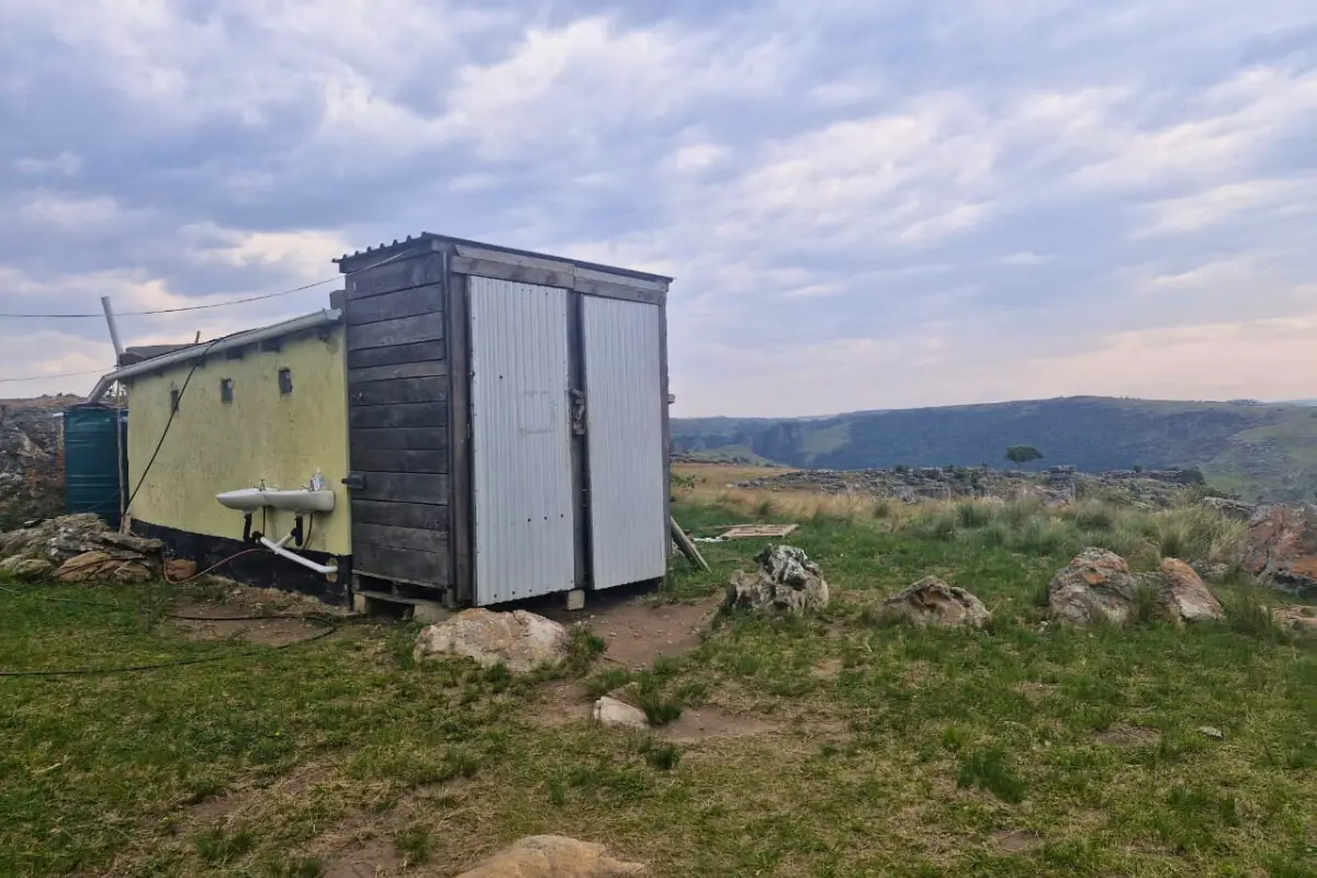 An outdoor toilet and shower facility at the homestay