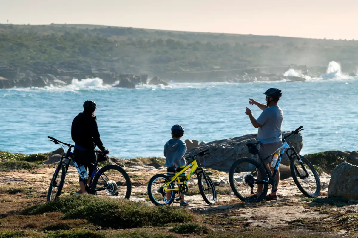 Family cycling along the coast at Mkambati Nature Reserve