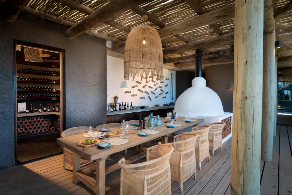 The dining area at GweGwe with wine cellar and wood-fired pizza oven