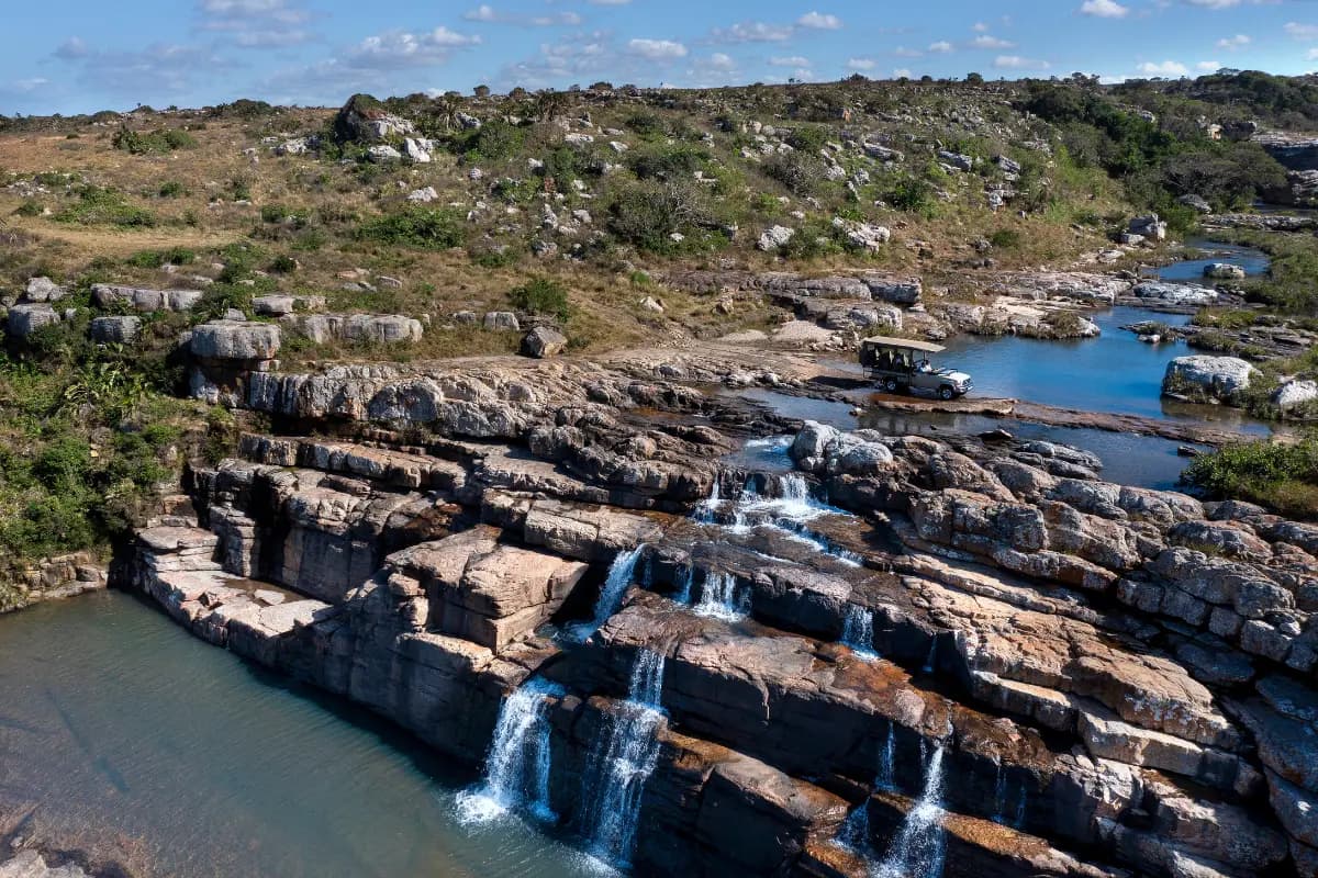 Horseshoe Falls cascading over layered rock in Mkambati Nature Reserve