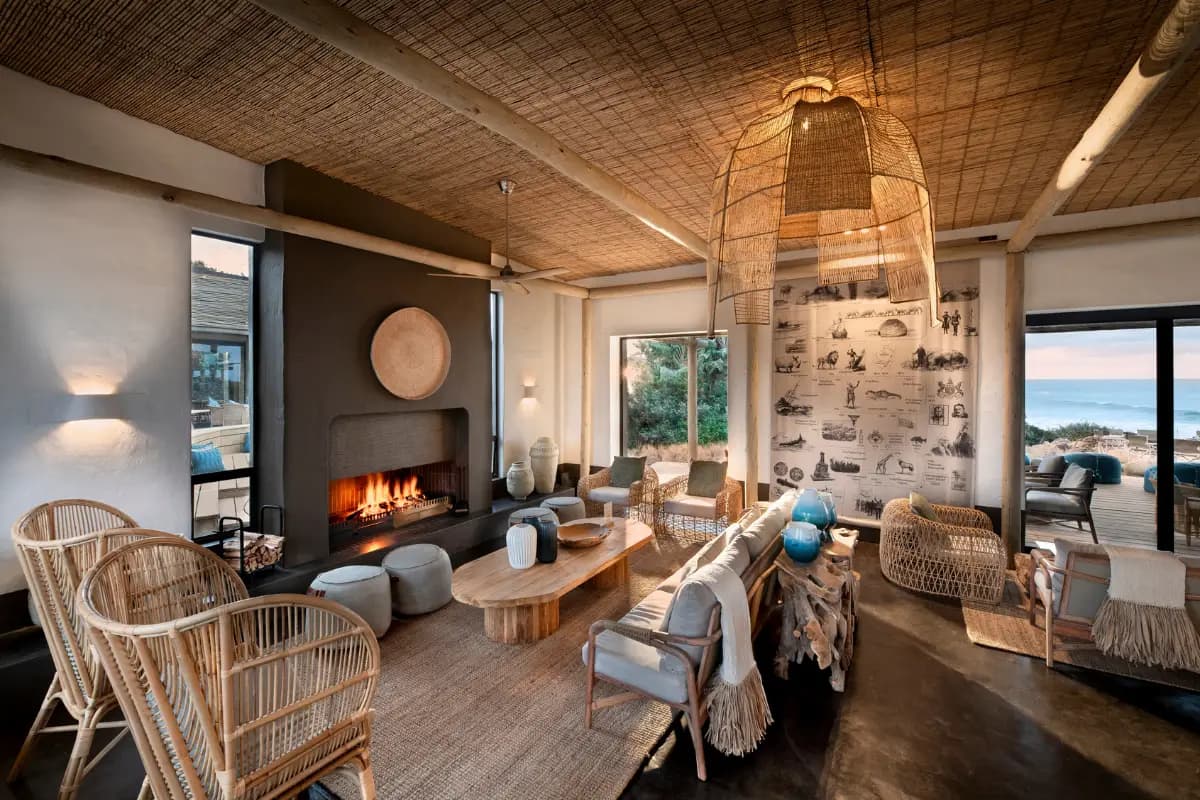 The elegant lounge at GweGwe with fireplace and ocean views