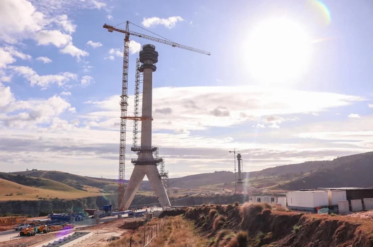 The two concrete pylons of the Msikaba Bridge standing above the gorge during construction, with a tower crane alongside, N2 Wild Coast Road, Eastern Cape, South Africa