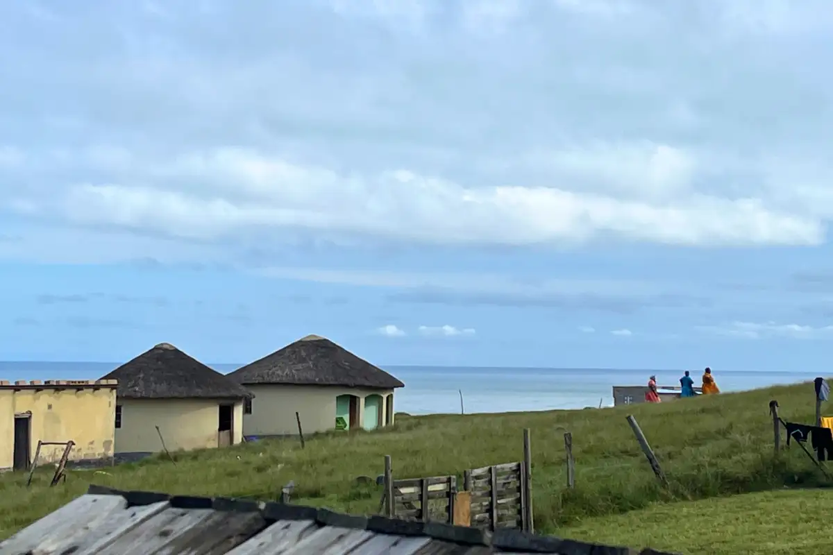 Village rondavels overlooking the ocean