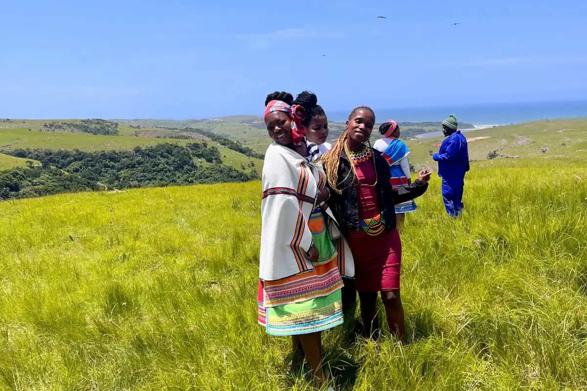 Xhosa women in traditional dress on the hillside