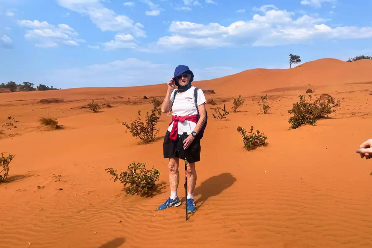 Hiker standing in the Red Desert dunes