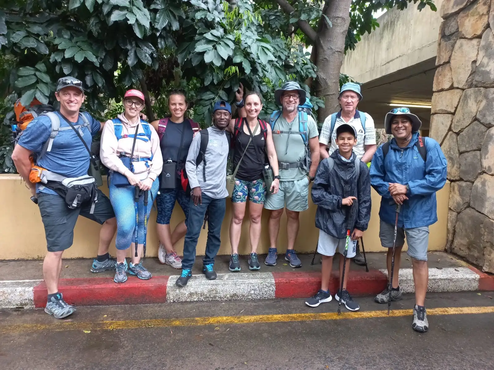 Group of eight hikers with backpacks and sun hats gathered at the Wild Coast Sun ready to begin the Mtentu Ramble guided coastal hike