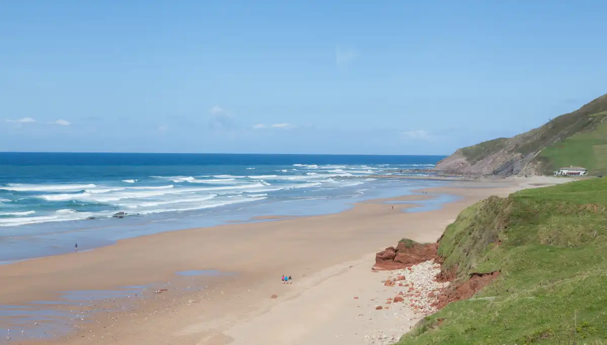Wild Coast beach with dramatic cliffs and green headland, Eastern Cape South Africa